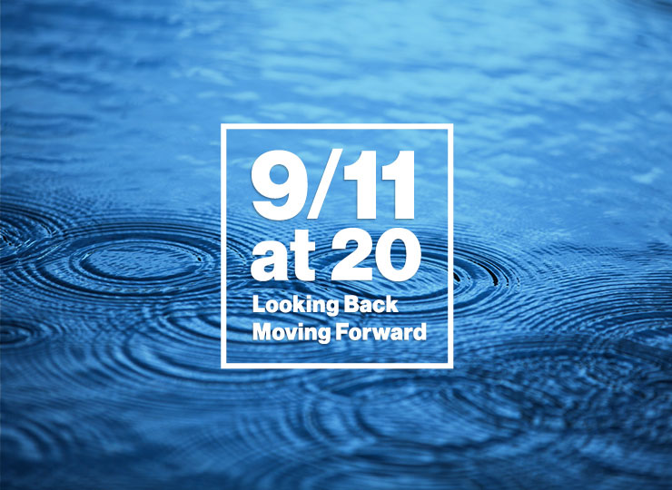 A framed text box that says "9/11 at 20" is set over a close-up image of a blue sea.