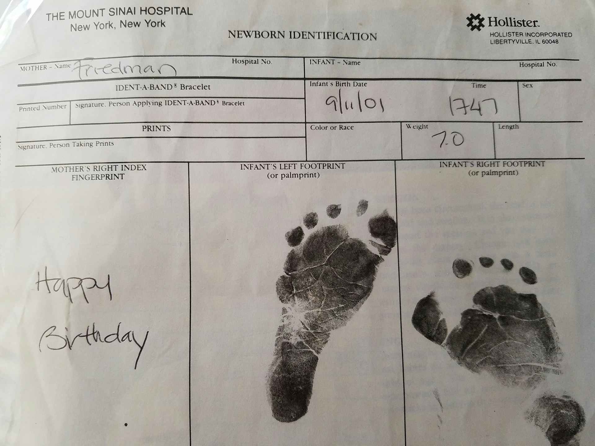 A newborn identification form from Mount Sinai hospital dated 9/11/01 with a baby's footprints and other identifying information.