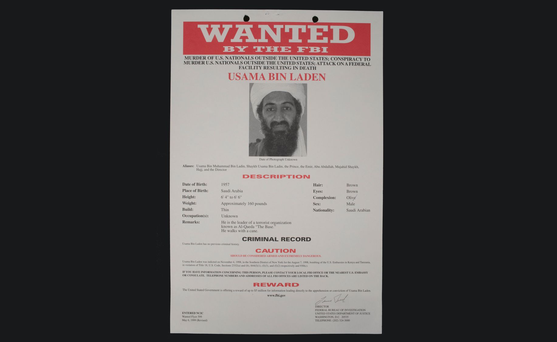 FBI wanted poster for Osama bin Laden. It includes a black and white photo of bin Laden and his physical description.