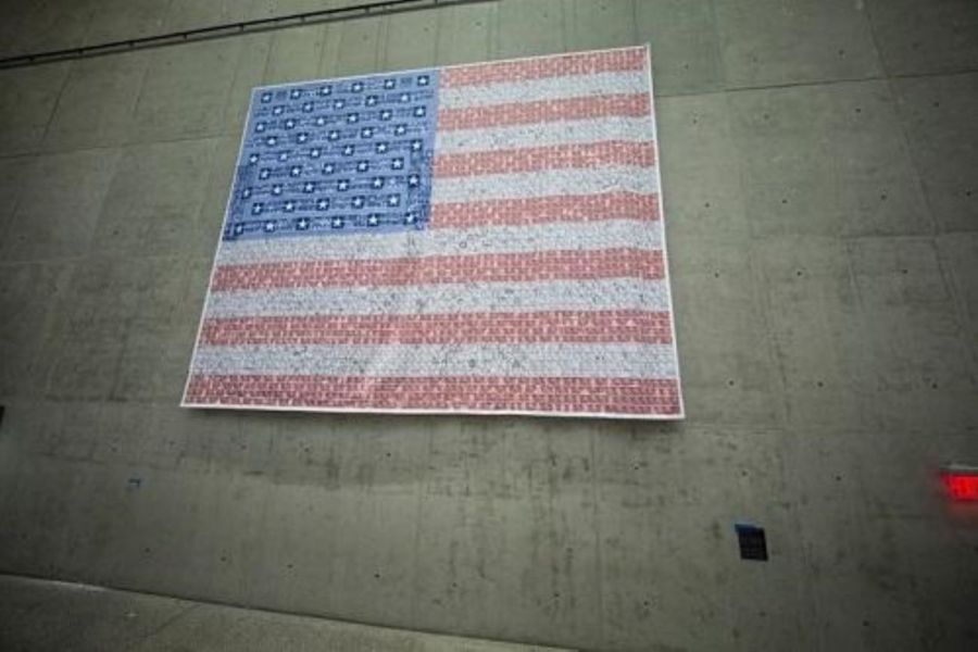American flag of remembrance on a concrete wall