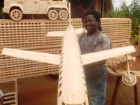 B-ARTIST FOMBE NFOR CELESTINE HOLDING A 1.5M LONG PLANE.JPG