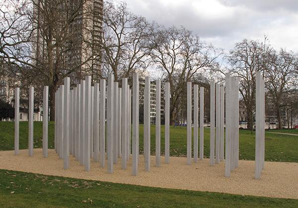 The 7/7 Memorial in Hyde Park, London, features beams standing in a section of the park.