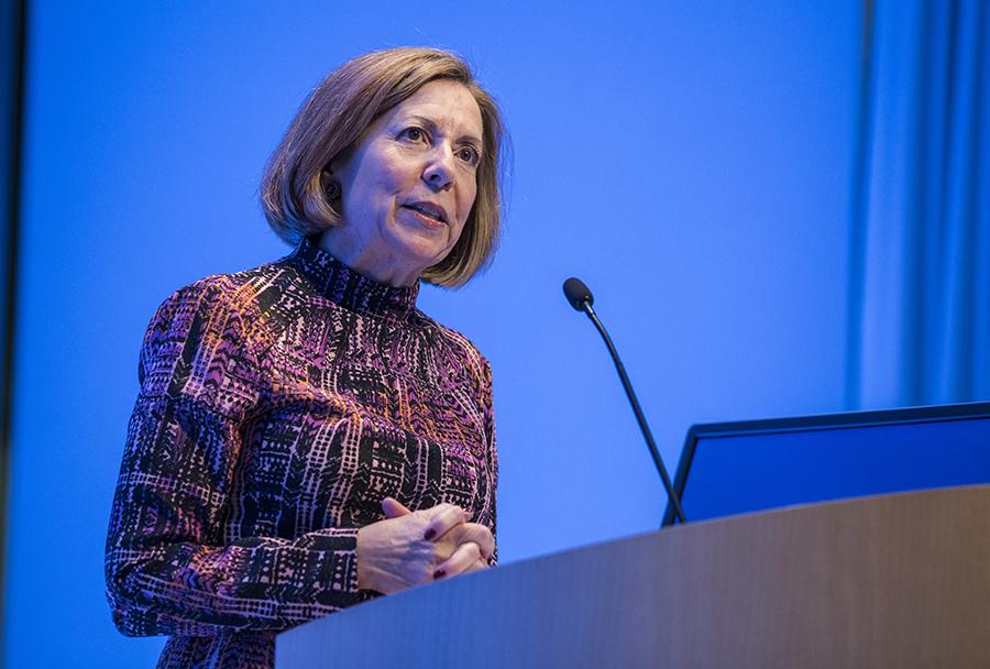 9/11 Memorial & Museum President Alice Greenwald speaks at a podium during a program in the Museum Auditorium.