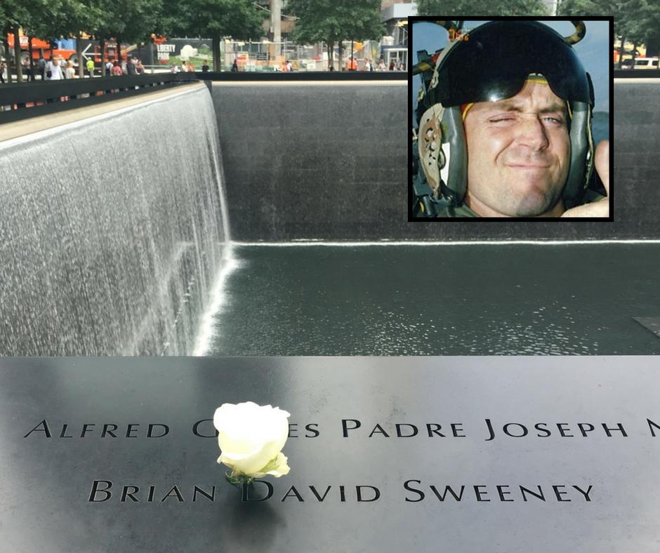 A white rose has been placed at the name of Brian David Sweeney. An inset photo of Sweeney is to the right of the image.