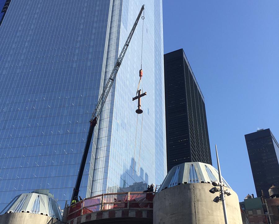 A crane places a cross atop St. Nicholas Greek Orthodox Church at the World Trade Center.
