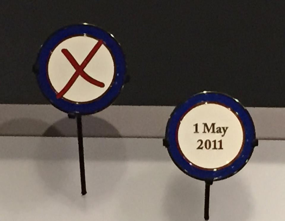 Operation Neptune Spear commemorative coins are displayed at the 9/11 Memorial Museum. One of them has a red X on it and the other says May 1, 2011.