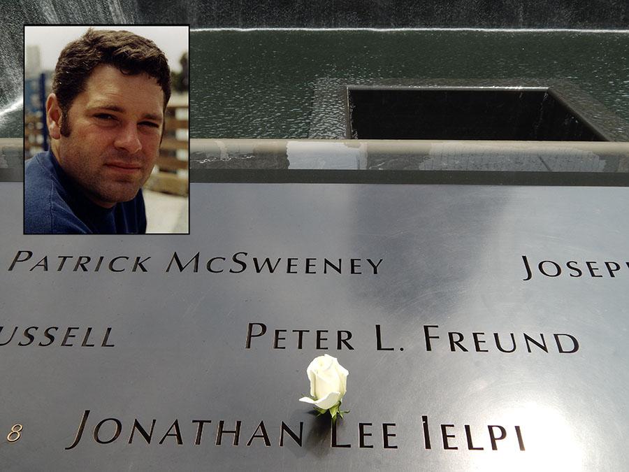 A rose has been placed on the name of FDNY firefighter Jonathan Ielpi at the 9/11 Memorial. An inset photo shows Ielpi smiling for a photo.