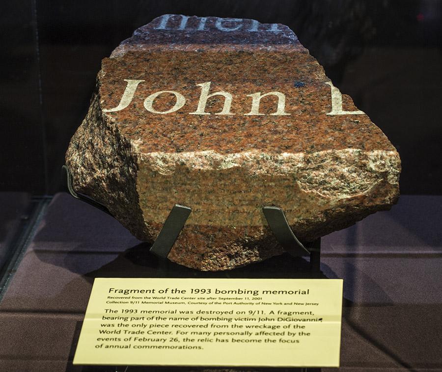 A fragment of the destroyed granite memorial to the victims of the 1993 World Trade Center bombing is on display at the Museum. The name John can be made out on the chunk of red, white, and black granite.