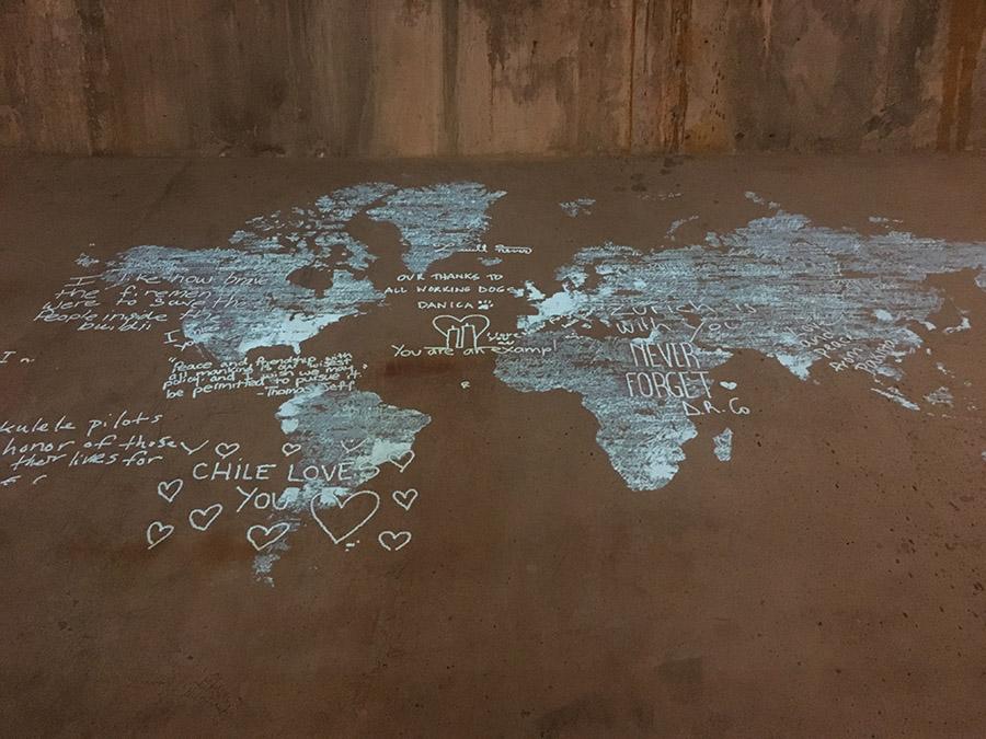 Messages of remembrance left by visitors are displayed on a map of the world at the signing steel in the Museum.