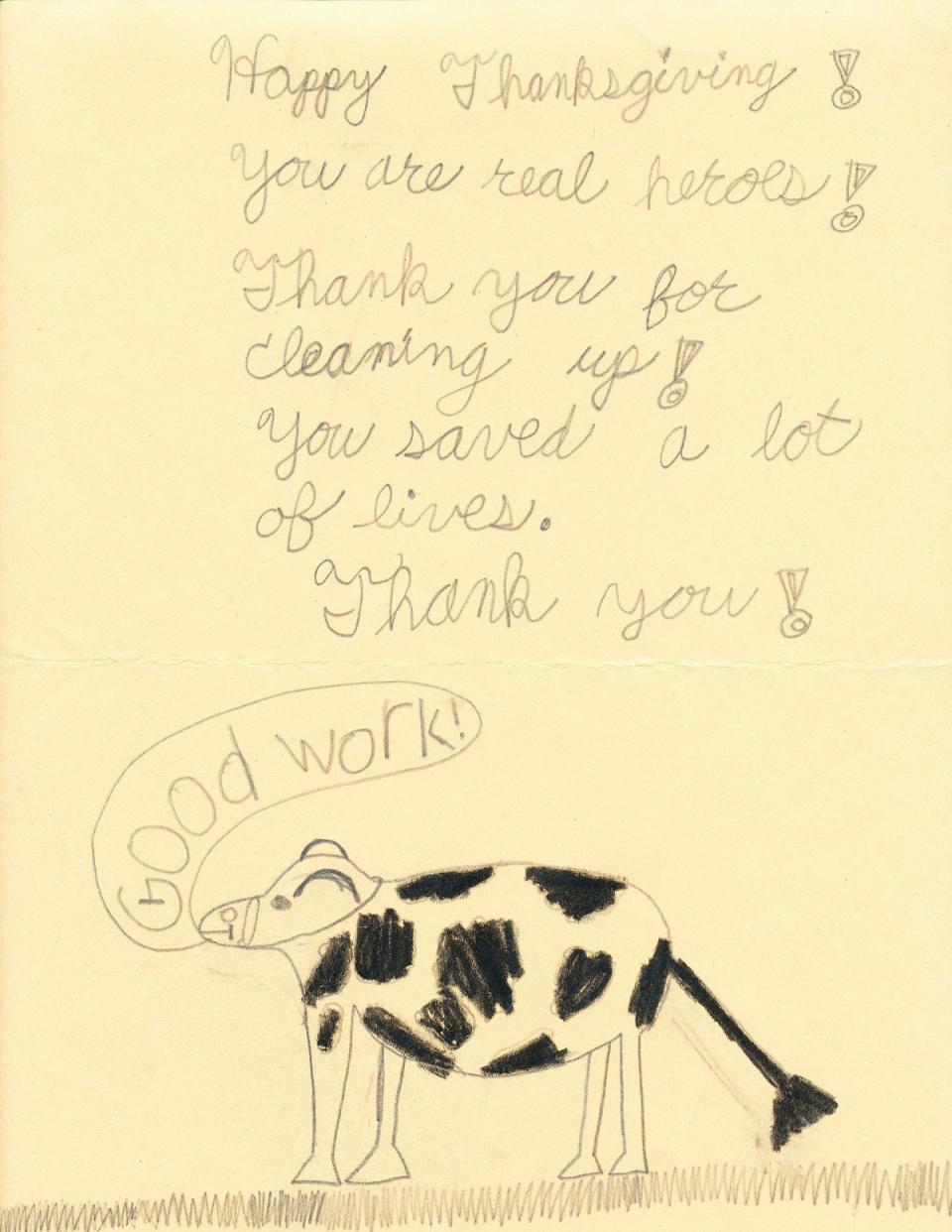 A child’s drawing created at Trinity Church after 9/11 shows an animal saying the words “Good work.” A message above the drawing of the animal reads: “Happy Thanksgiving! You are the heroes! Thank you for cleaning up! You saved a lot of lives! Thank you!”