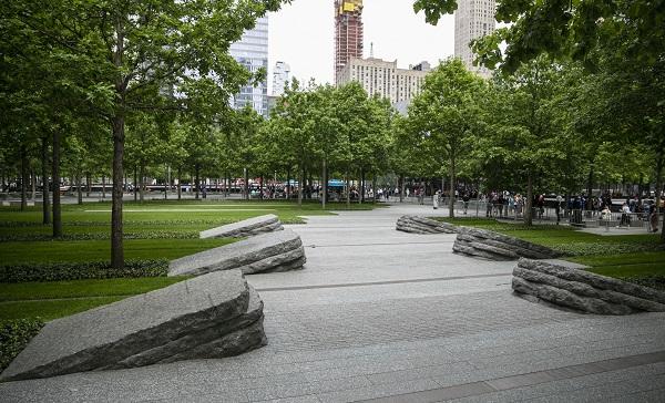 The six granite monoliths line the walkway of the 9/11 Memorial Glade. Dozens of trees surround the Glade.
