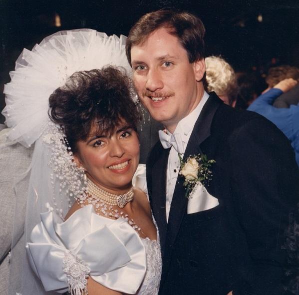 Monica Rodriquez and her husband Edward Smith pose for a photo during their wedding. 