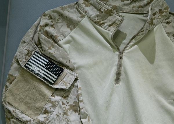 A camouflage shirt worn by a U.S. Navy seal team member who was present for Osama bin Laden’s killing is displayed at the 9/11 Memorial Museum.