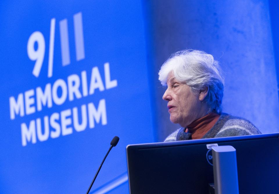 Ellen Karas speaks at a podium in the Museum’s Auditorium.