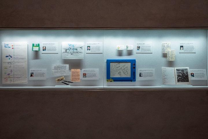 In this interior look at the In Memoriam exhibition, one can see personal items that belonged to victims of the attacks on view in a display case.