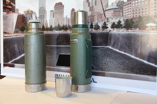 Two green thermoses belonging to Mohawk Indian ironworkers are displayed on a table at the Museum.