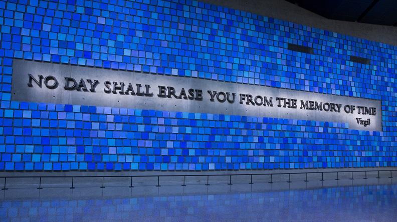 This element opens a lightbox image gallery - A large plaque in Memorial Hall reads, “No day shall erase you from the memory of time.” The quote from Virgil’s epic poem The Aeneid is surrounded by 2,983 individual blue tiles that comprise "Trying to Remember the Color of the Sky on That September Morning,” an installation by Spencer Finch. Every square is a unique shade of blue, reflecting the artist's attempt to remember the color of the sky on the morning of 9/11 and commemorating the victims of September 11, 2001 and February 26, 1993.