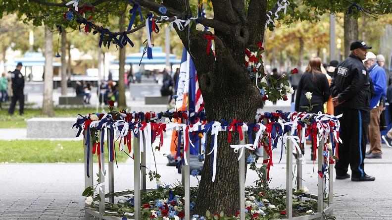 Visitors leave tribute ribbons of red, white, and blue at the Survivor Tree after the terrorist attacks in downtown Manhattan on Wednesday, Nov. 01, 2017.