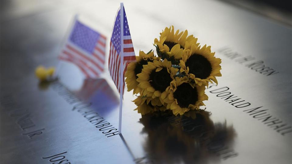 Sunflowers and small American flags on the Memorial